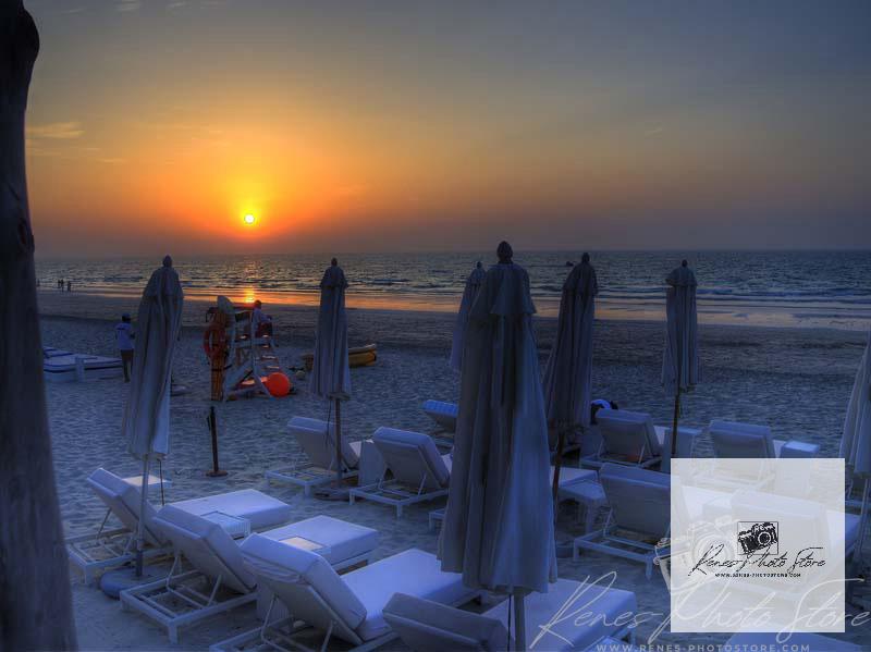 Sunset Loungers on Saadiyat Island, Abu Dhabi | Serene Beach Photo Download