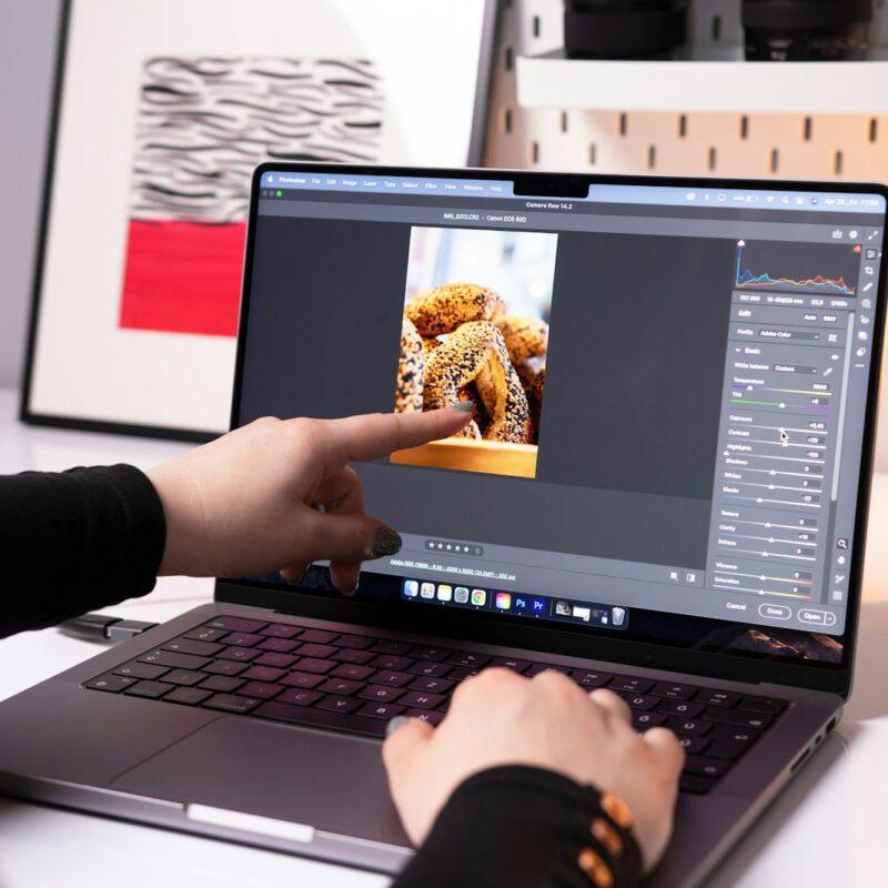 A person sitting in front of a laptop computer